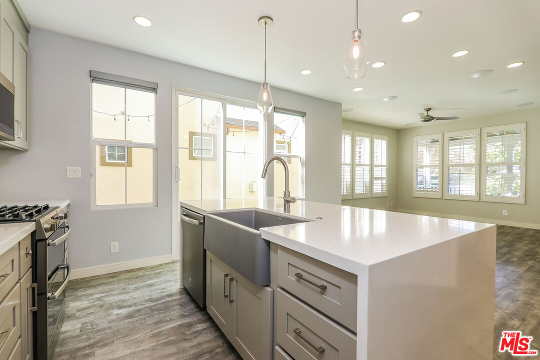 3 Wood Barn Road Ladera Ranch, CA 92694 - Photo 13 of 27 a kitchen with sink attached with living room