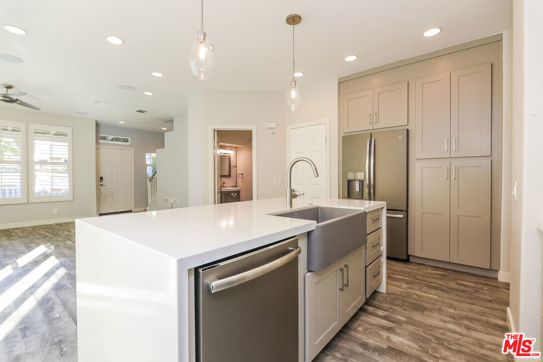 3 Wood Barn Road Ladera Ranch, CA 92694 - Photo 14 of 27 a kitchen with a sink a counter space and appliances