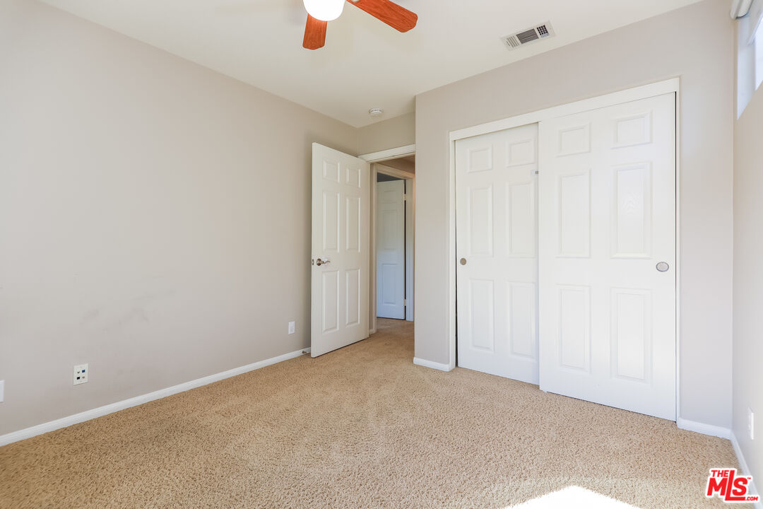 3 Wood Barn Road Ladera Ranch, CA 92694 - Photo 22 of 27 an empty room with closet and windows