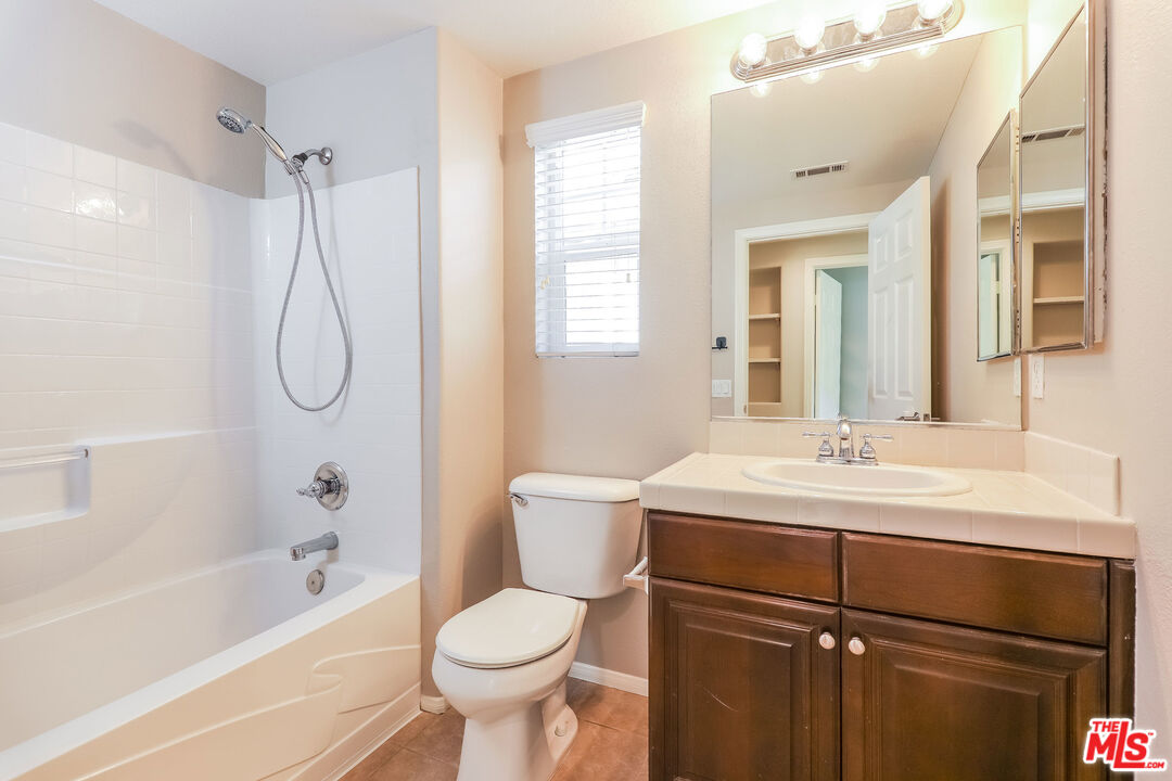 3 Wood Barn Road Ladera Ranch, CA 92694 - Photo 26 of 27 a bathroom with a sink toilet and shower