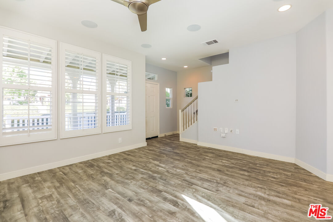 3 Wood Barn Road Ladera Ranch, CA 92694 - Photo 6 of 27 a view of an empty room with a window and wooden floor