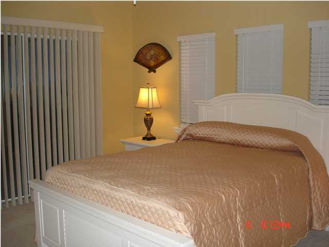 1732 Hwy Santa Rosa Beach, Unit 403 30A Santa Rosa Beach, FL 32459 - Photo 11 of 15 a bedroom with a bed and a painting on the wall