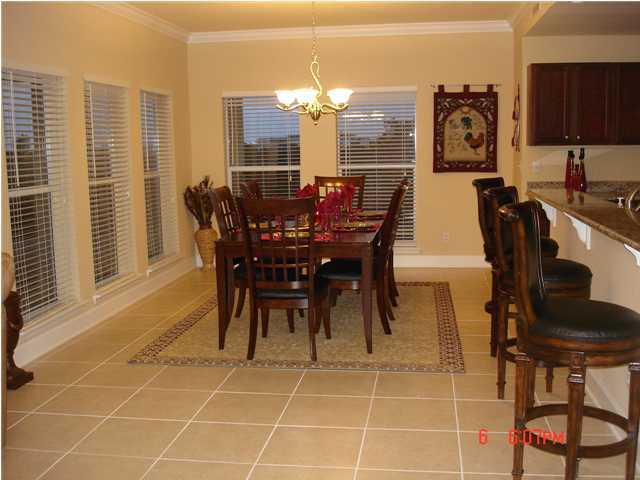 1732 Hwy Santa Rosa Beach, Unit 403 30A Santa Rosa Beach, FL 32459 - Photo 2 of 15 a view of a dining room with furniture and chandelier