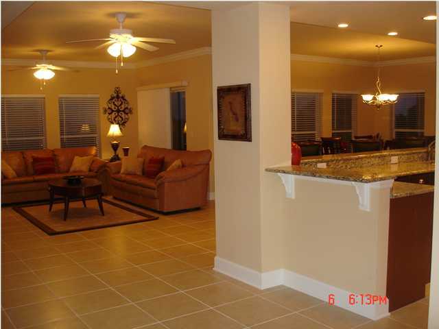 1732 Hwy Santa Rosa Beach, Unit 403 30A Santa Rosa Beach, FL 32459 - Photo 5 of 15 a living room with patio furniture and a chandelier