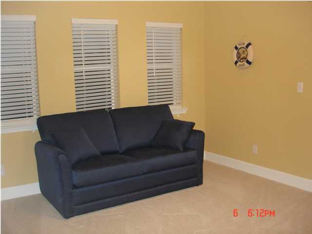1732 Hwy Santa Rosa Beach, Unit 403 30A Santa Rosa Beach, FL 32459 - Photo 10 of 15 a living room with furniture and a window