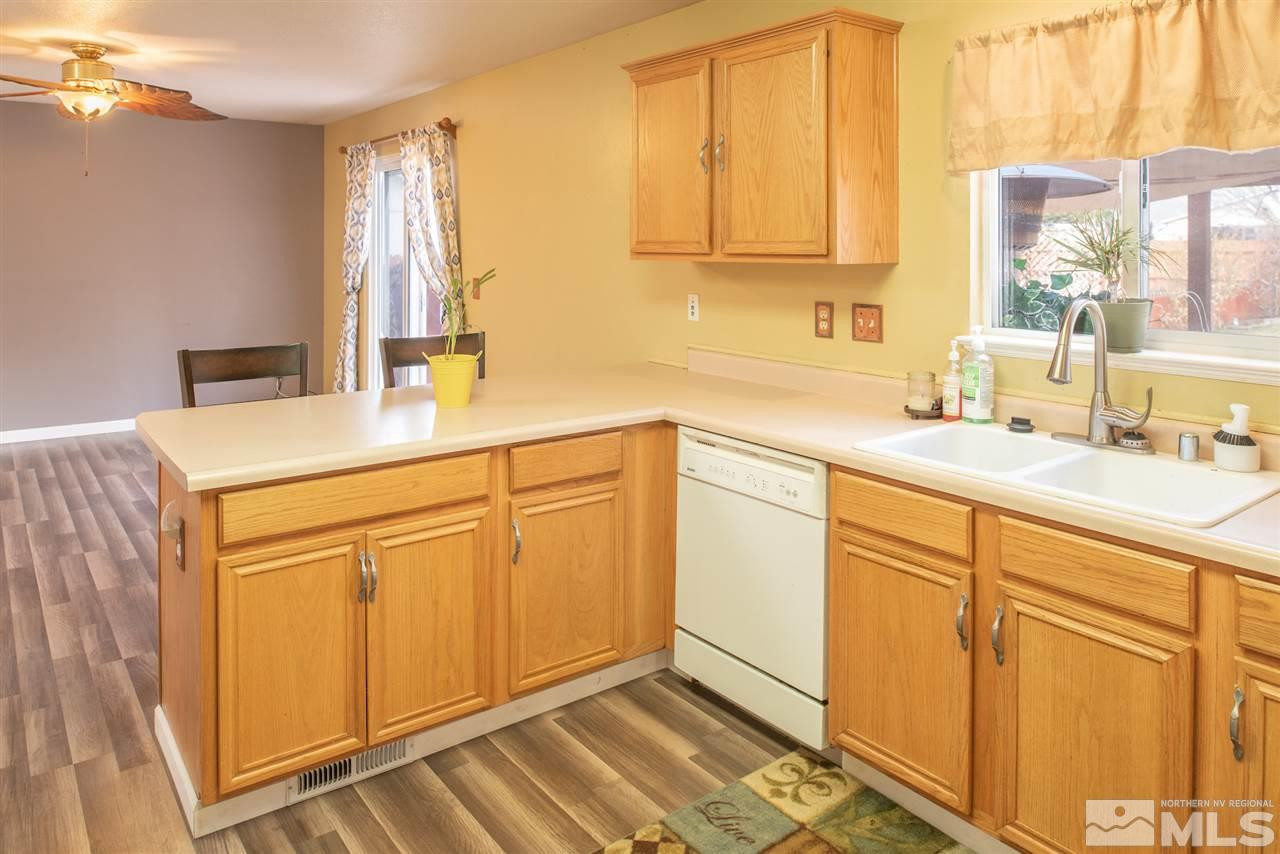 18205 Fontana Court Reno, NV 89508 - Photo 11 of 27 a kitchen with cabinets appliances and a sink