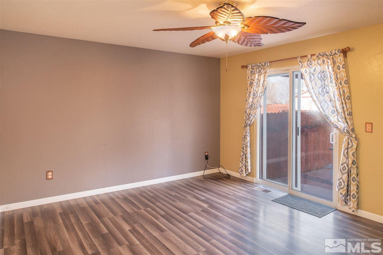 18205 Fontana Court Reno, NV 89508 - Photo 13 of 27 a view of room with window and wooden floor