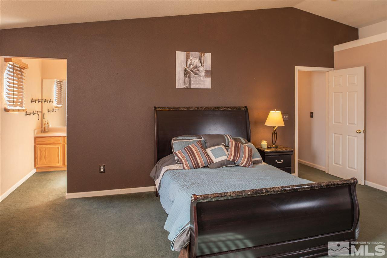 18205 Fontana Court Reno, NV 89508 - Photo 15 of 27 a bed room with a bed and window
