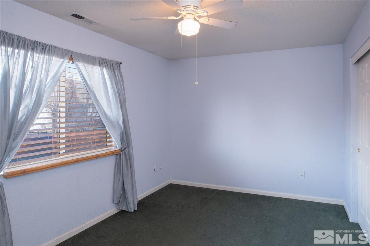 18205 Fontana Court Reno, NV 89508 - Photo 21 of 27 wooden floor in an empty room with a window