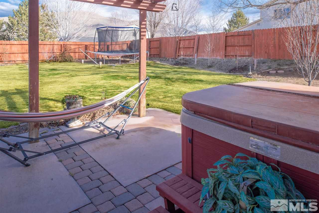 18205 Fontana Court Reno, NV 89508 - Photo 24 of 27 a view of a backyard with sitting area