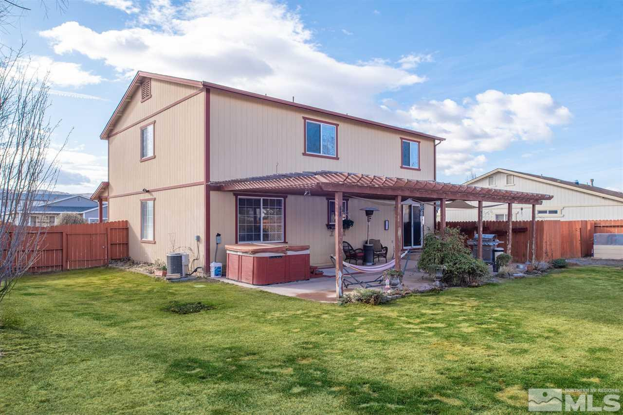 18205 Fontana Court Reno, NV 89508 - Photo 25 of 27 a front view of a house with a garden