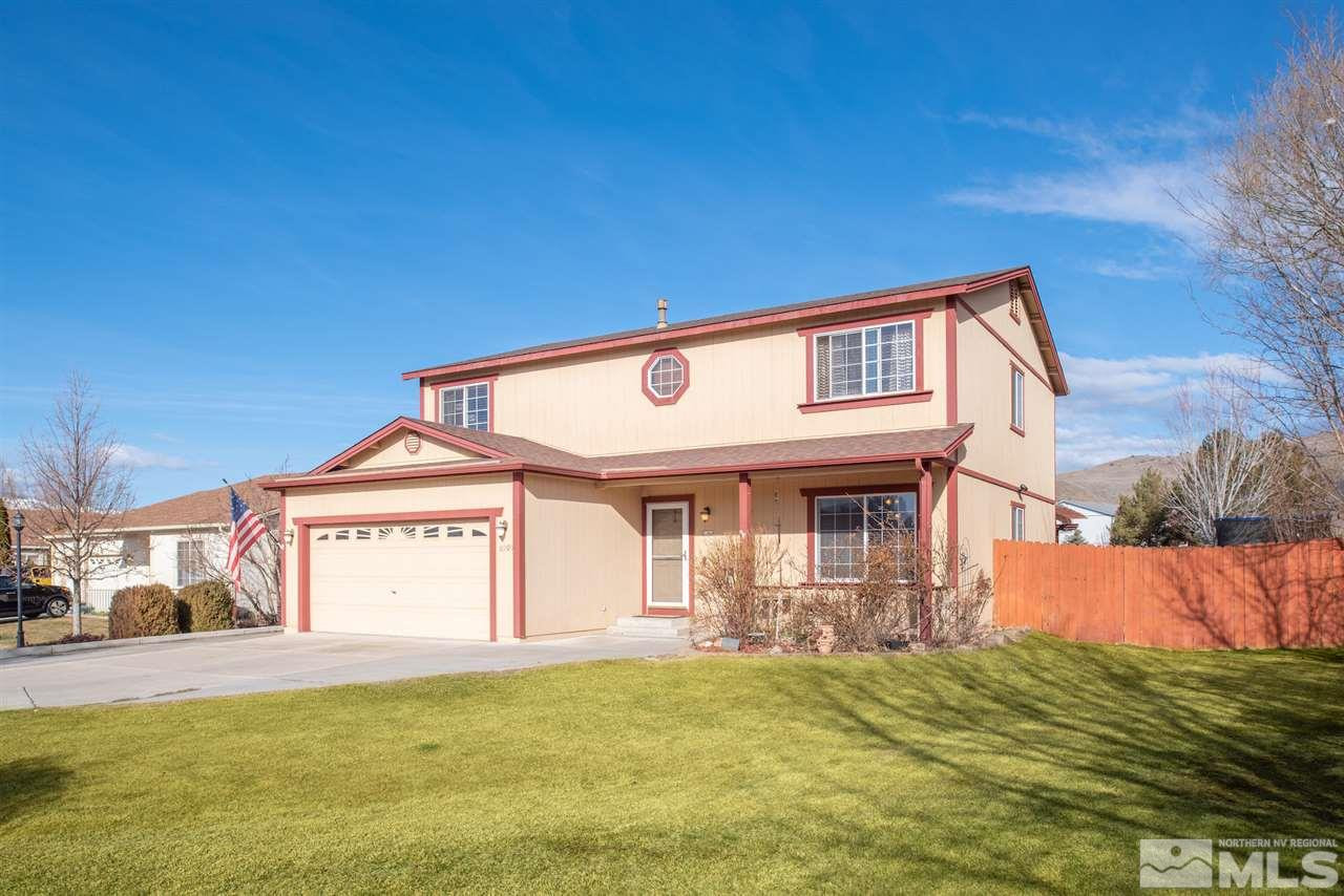 18205 Fontana Court Reno, NV 89508 - Photo 3 of 27 a front view of a house with a yard