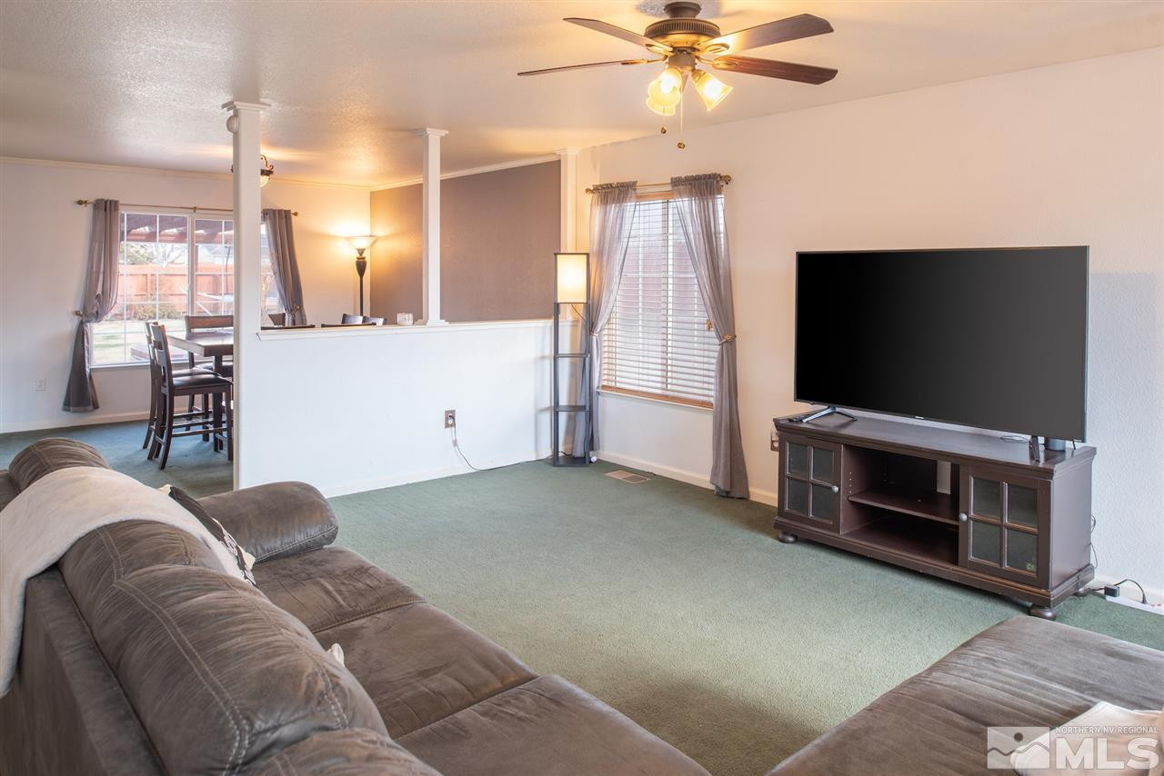 18205 Fontana Court Reno, NV 89508 - Photo 5 of 27 a living room with furniture and a flat screen tv