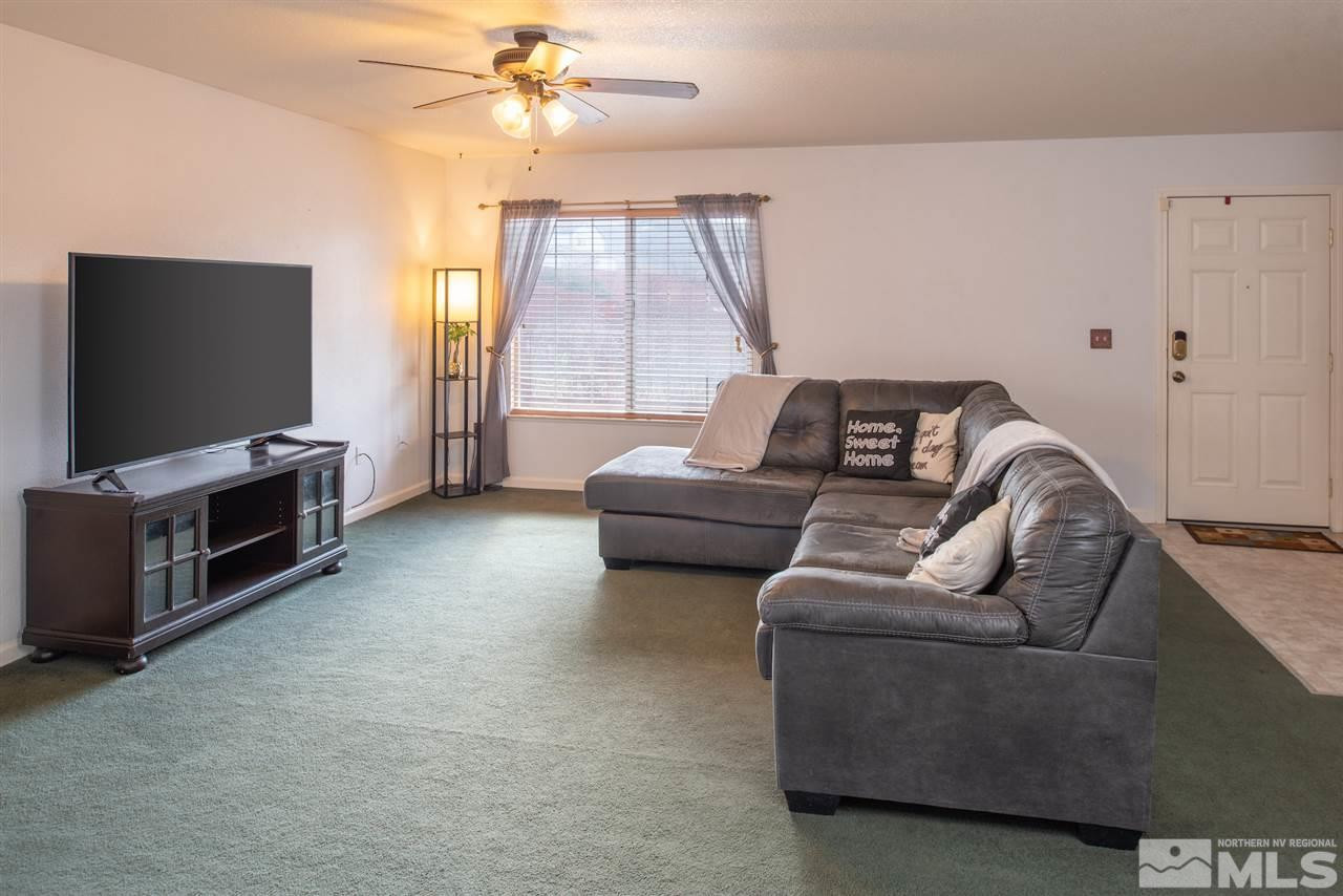18205 Fontana Court Reno, NV 89508 - Photo 6 of 27 a living room with furniture and a flat screen tv