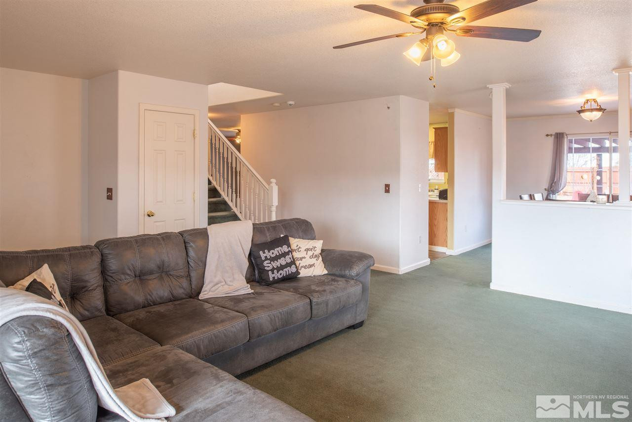 18205 Fontana Court Reno, NV 89508 - Photo 7 of 27 a living room with furniture and a ceiling fan