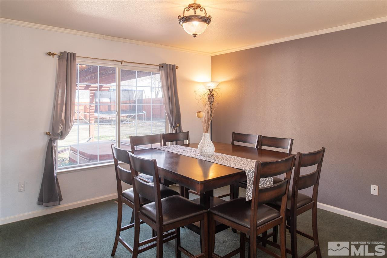 18205 Fontana Court Reno, NV 89508 - Photo 8 of 27 a view of a dining room with furniture and window