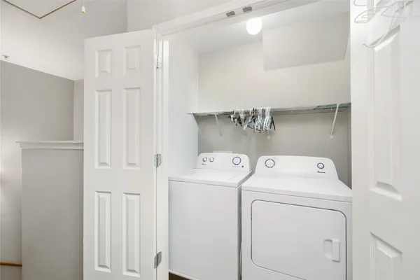 a view of storage and utility room with washer and dryer
