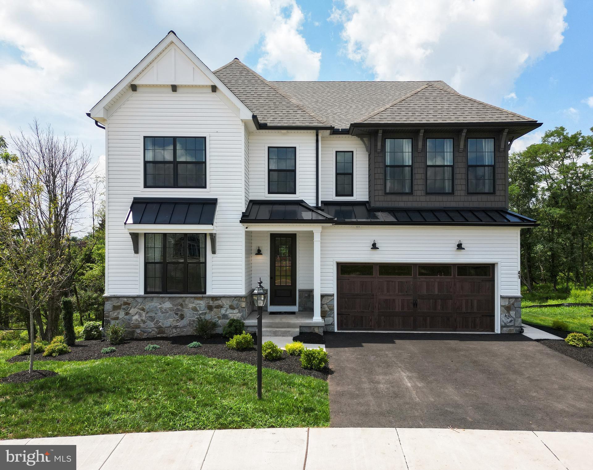 660 Lawrence Boulevard, Unit COVINGTON Lancaster, PA 17601 - Photo 1 of 39 a front view of a house with garden