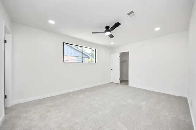 a view of an empty room with a window