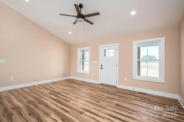 a kitchen with a sink cabinets and window