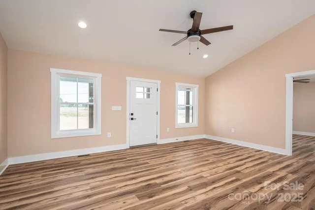 a view of a livingroom with wooden floor