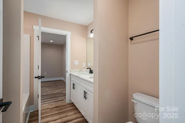 a view of a house with a yard and deck