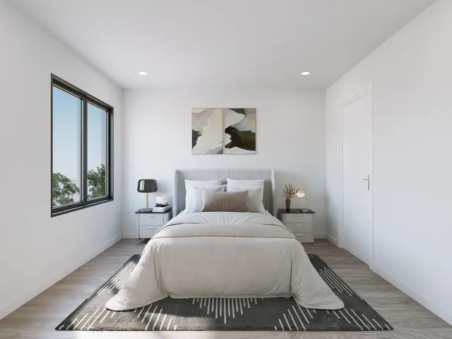 a bedroom with a bed and window