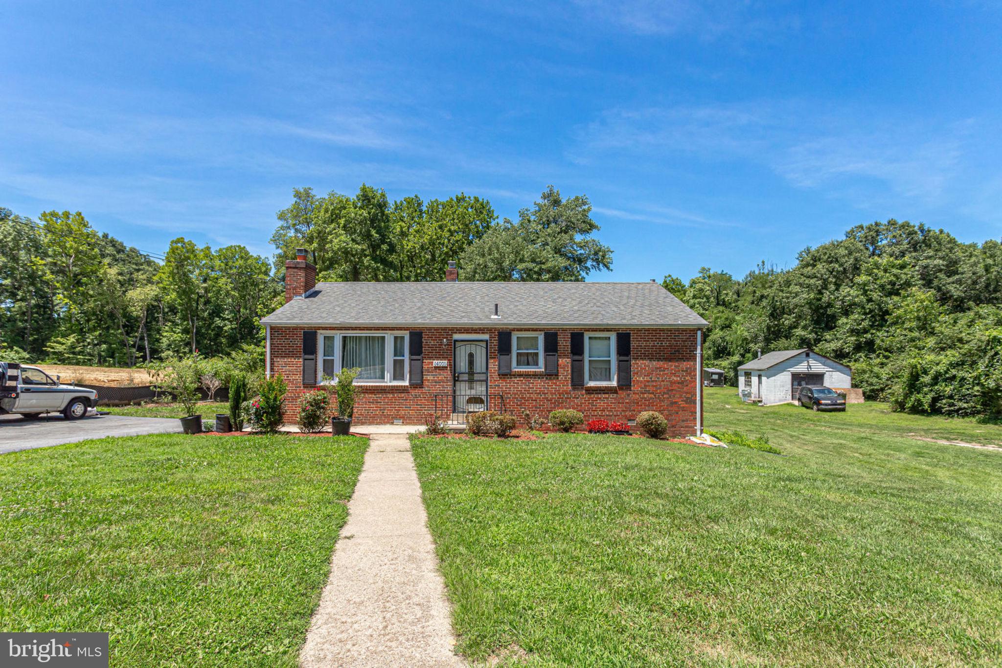 14001 Livingston Road Clinton, MD 20735 - Photo 1 of 28 a front view of a house with garden