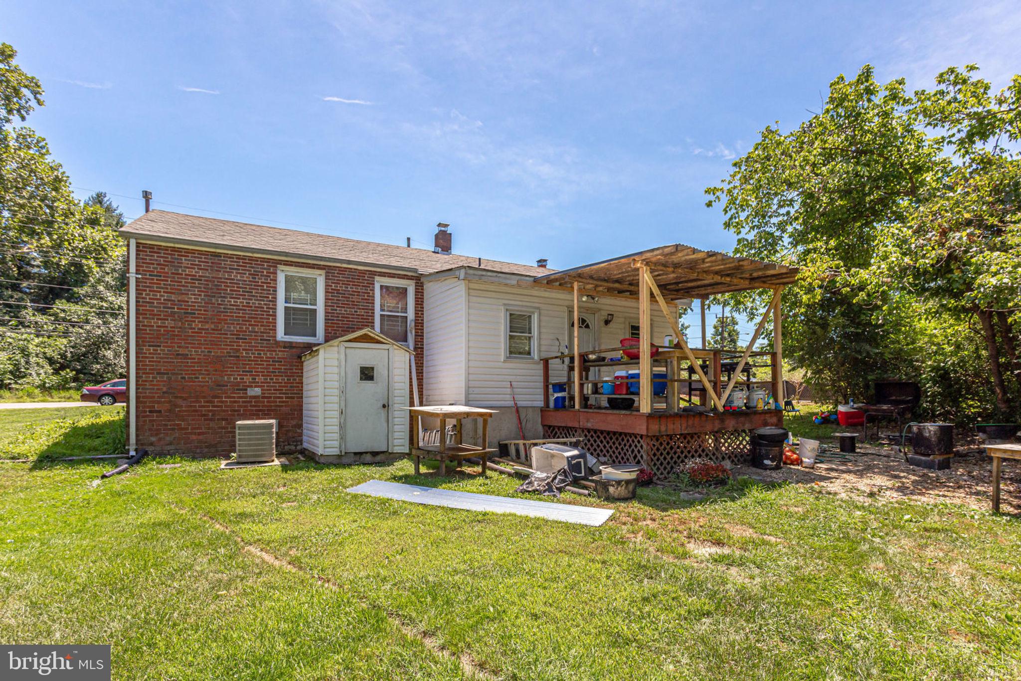 14001 Livingston Road Clinton, MD 20735 - Photo 23 of 28 a view of a house with swimming pool and sitting area