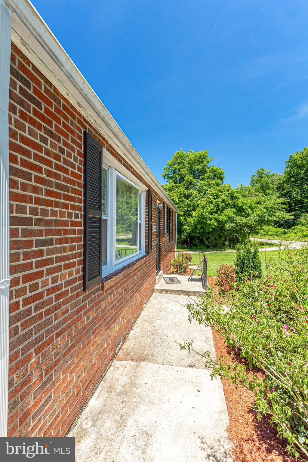14001 Livingston Road Clinton, MD 20735 - Photo 5 of 28 a view of a backyard with plants and lake view
