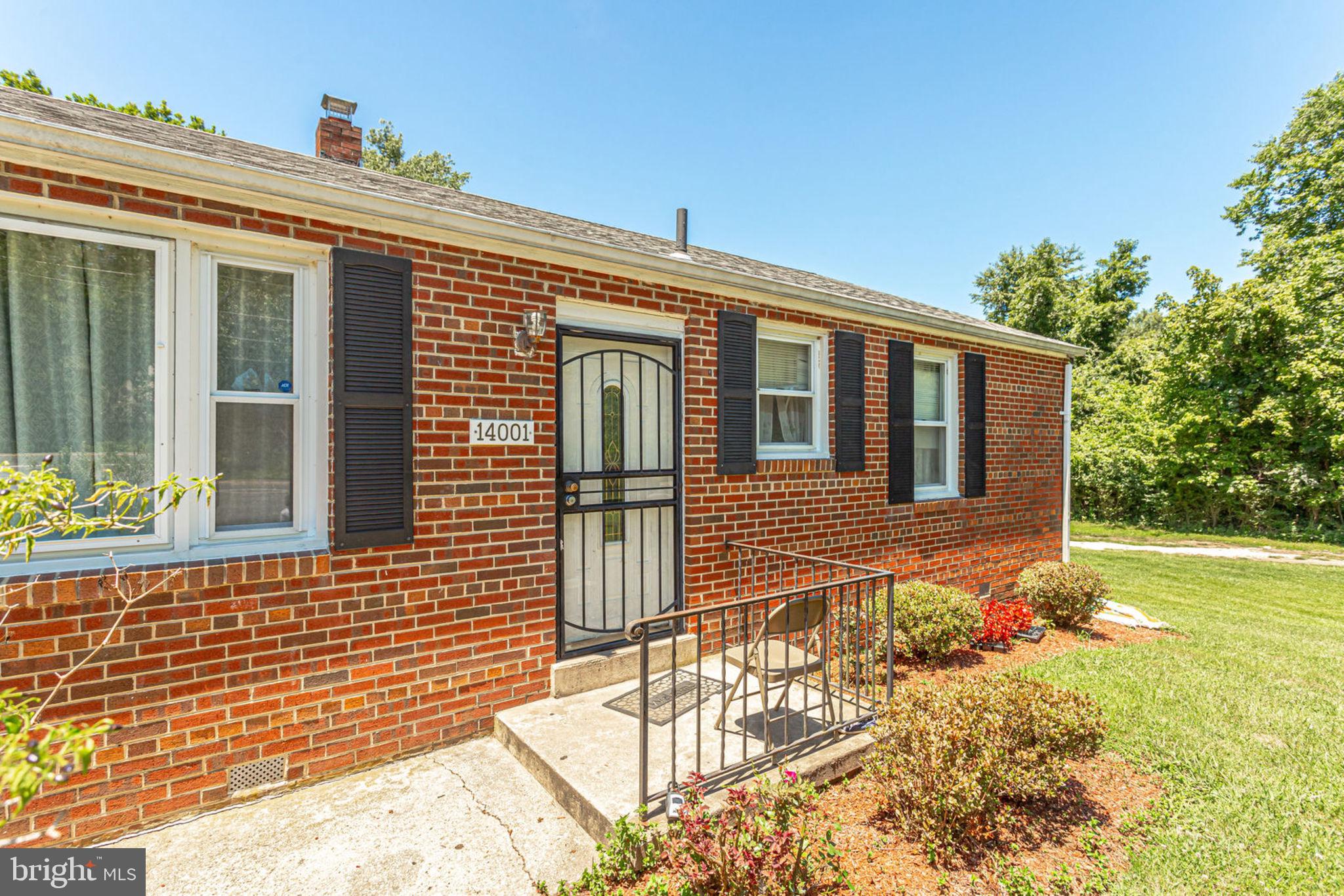 14001 Livingston Road Clinton, MD 20735 - Photo 6 of 28 a front view of a house with a yard