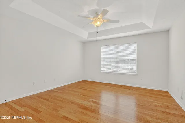 a view of washer and dryer with kitchen in the background