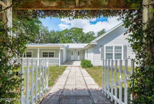 a view of swimming pool with trees in the background