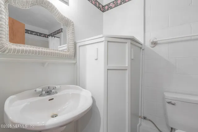 swimming pool view with a garden space