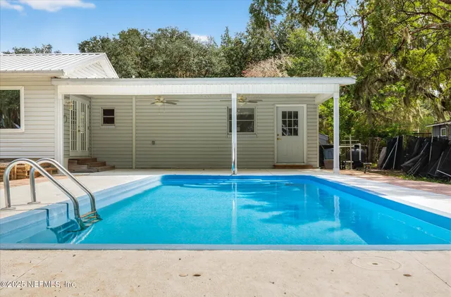 a view of wooden deck with a lake view