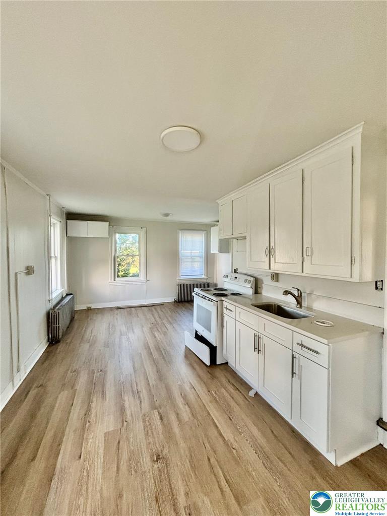 4067 Newburg Road Bethlehem, PA 18020 - Photo 6 of 19 Smooth wood floors flow seamlessly through this bright, open kitchen and adjoining living area.