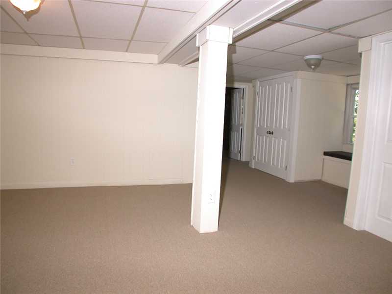 414 Arnold Road Coventry, RI 02816 - Photo 15 of 23 Den/Family/Great Room. Bsmt family room walk out to rear