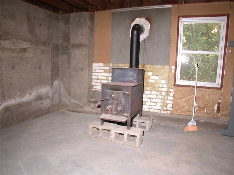 414 Arnold Road Coventry, RI 02816 - Photo 18 of 23 Other. Wood stove in bsmt to remain.
