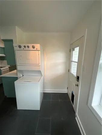 a view of storage and utility room with washer and dryer