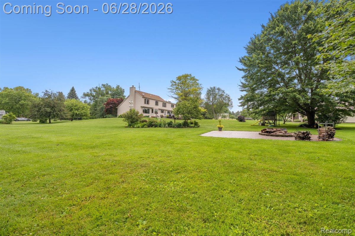 125 Olde Franklin Road Howell, MI 48855 - Photo 10 of 57 Brick paver patio with firepit