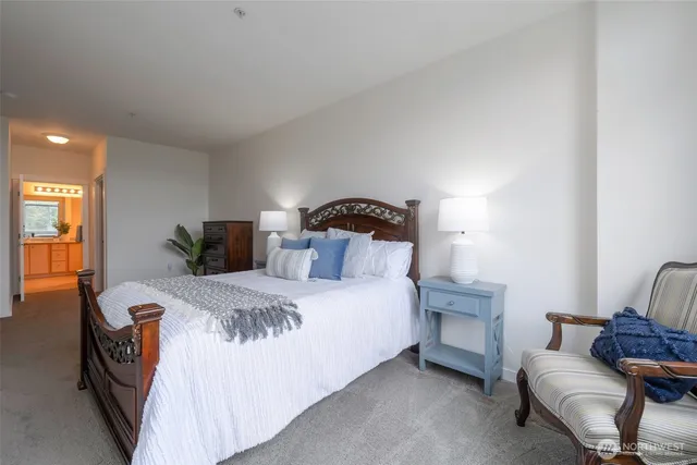 a bedroom with bed and window