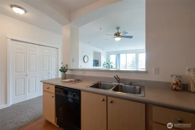 a kitchen with a sink and a window