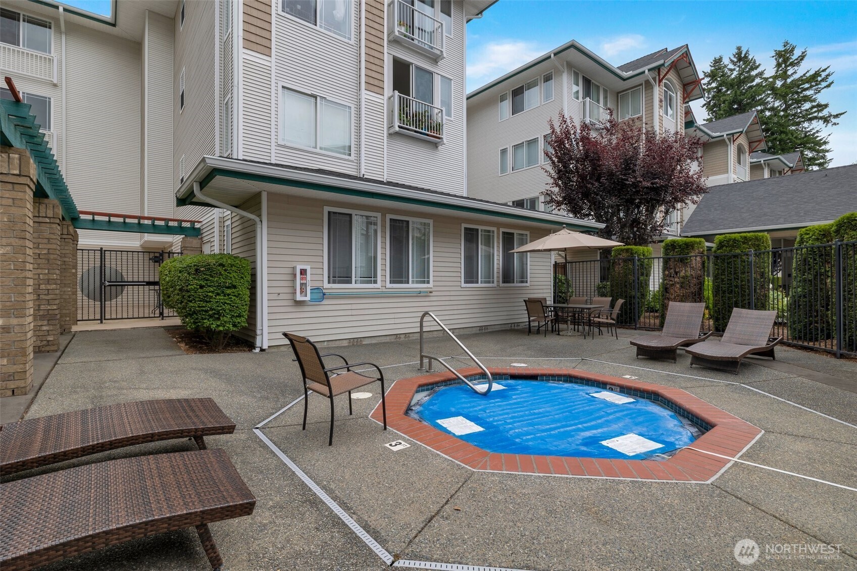 13301 Southeast 79th Place, Unit B402 Newcastle, WA 98059 - Photo 22 of 25 a view of a building with sitting area