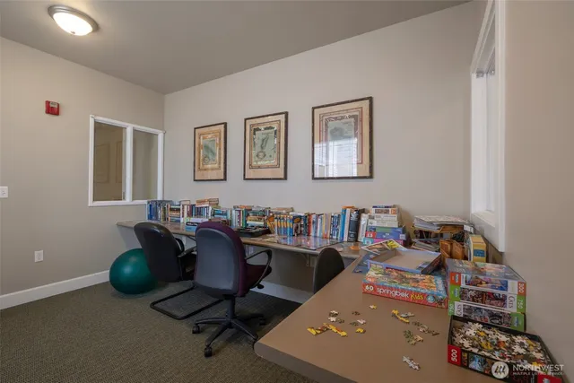 a view of a workspace with furniture