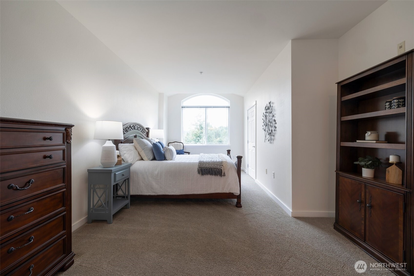 13301 Southeast 79th Place, Unit B402 Newcastle, WA 98059 - Photo 9 of 25 a bed room with bed and window