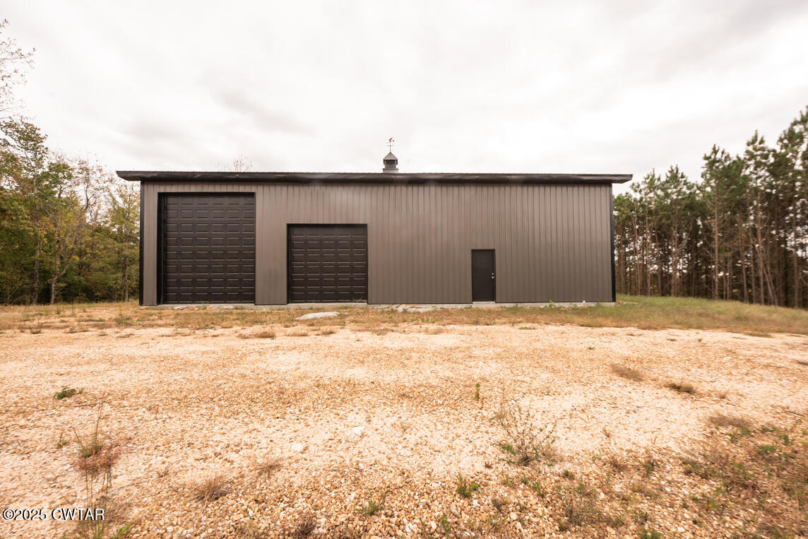190 Pine Tree Drive Parsons, TN 38363 - Photo 21 of 56 a view of a backyard of snow
