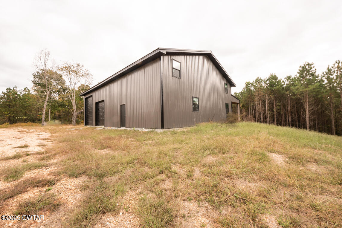 190 Pine Tree Drive Parsons, TN 38363 - Photo 26 of 56 a view of a house with a yard