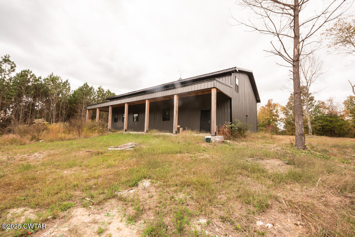 190 Pine Tree Drive Parsons, TN 38363 - Photo 33 of 56 a view of a house with a backyard