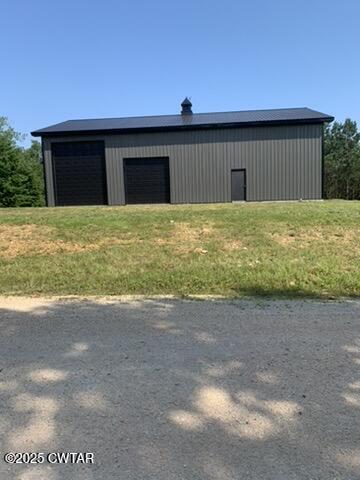 190 Pine Tree Drive Parsons, TN 38363 - Photo 6 of 56 a backyard of a house