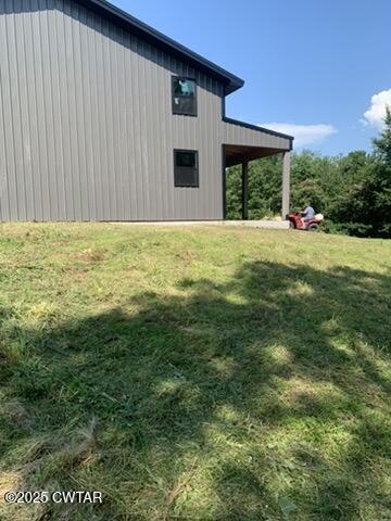 190 Pine Tree Drive Parsons, TN 38363 - Photo 7 of 56 a view of a house with a backyard